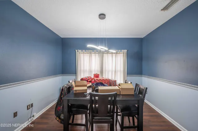 a view of a dining room with furniture window and outside view