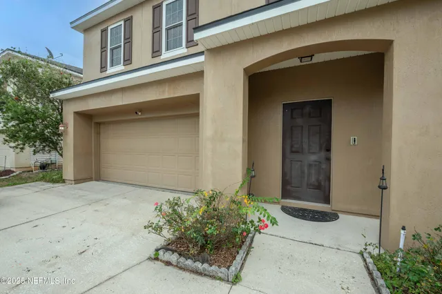 a view of a room with wooden floor and gym equipment