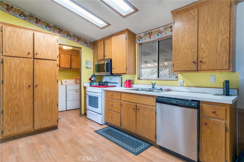 14250 Howe Place Beaumont, CA 92223 - Photo 20 of 31 a kitchen with sink cabinets and window