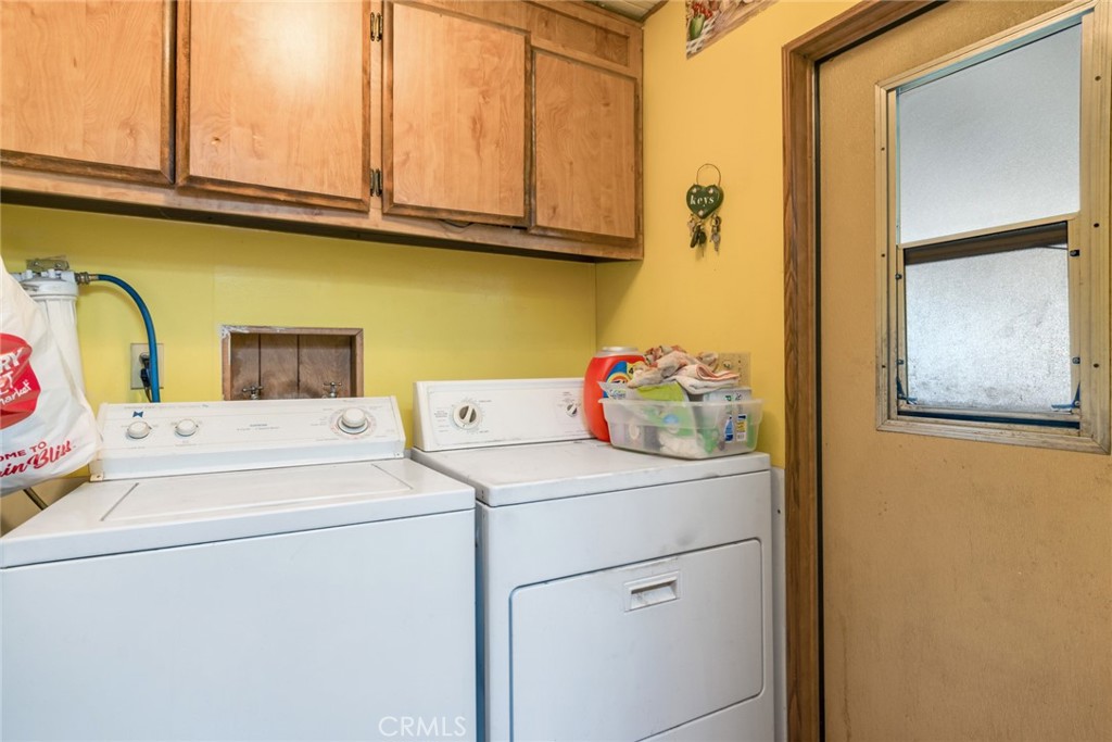 14250 Howe Place Beaumont, CA 92223 - Photo 21 of 31 a utility room with dryer and washer