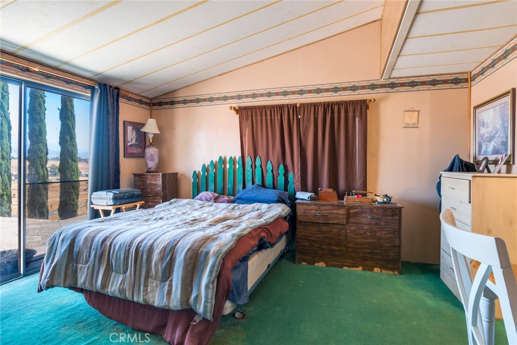 14250 Howe Place Beaumont, CA 92223 - Photo 24 of 31 a bedroom with a bed and a dresser