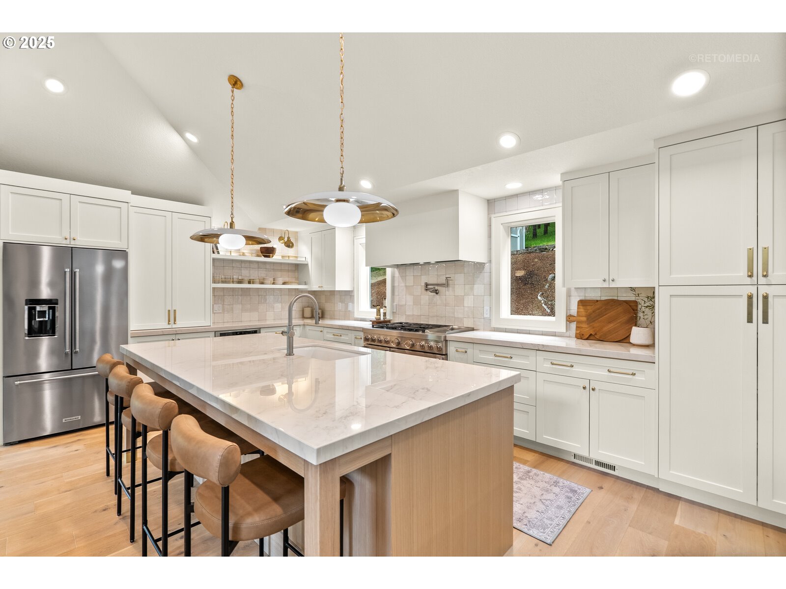 14819 Southwest Bell Road Sherwood, OR 97140 - Photo 13 of 45 a kitchen with stainless steel appliances kitchen island granite countertop a sink a stove a refrigerator and island