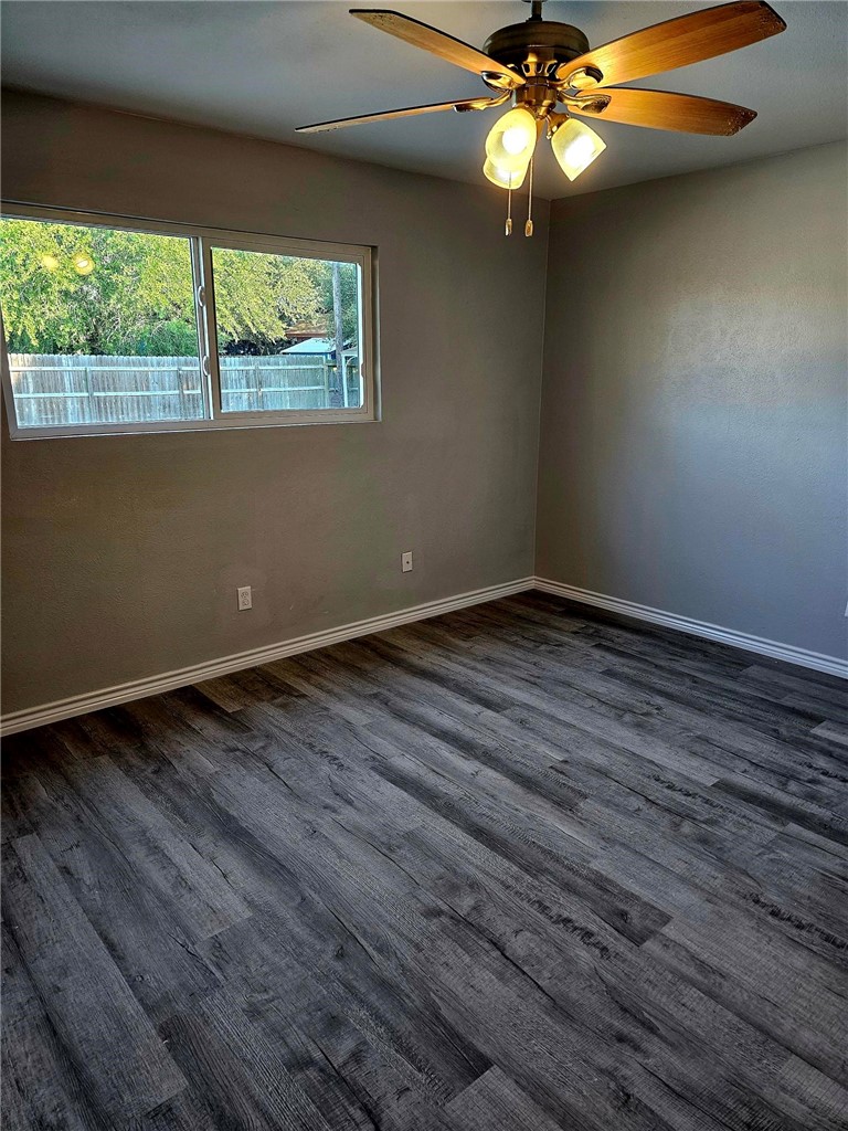 2313 Retta Drive Corpus Christi, TX 78418 - Photo 11 of 18 a view of an empty room with wooden floor and a window