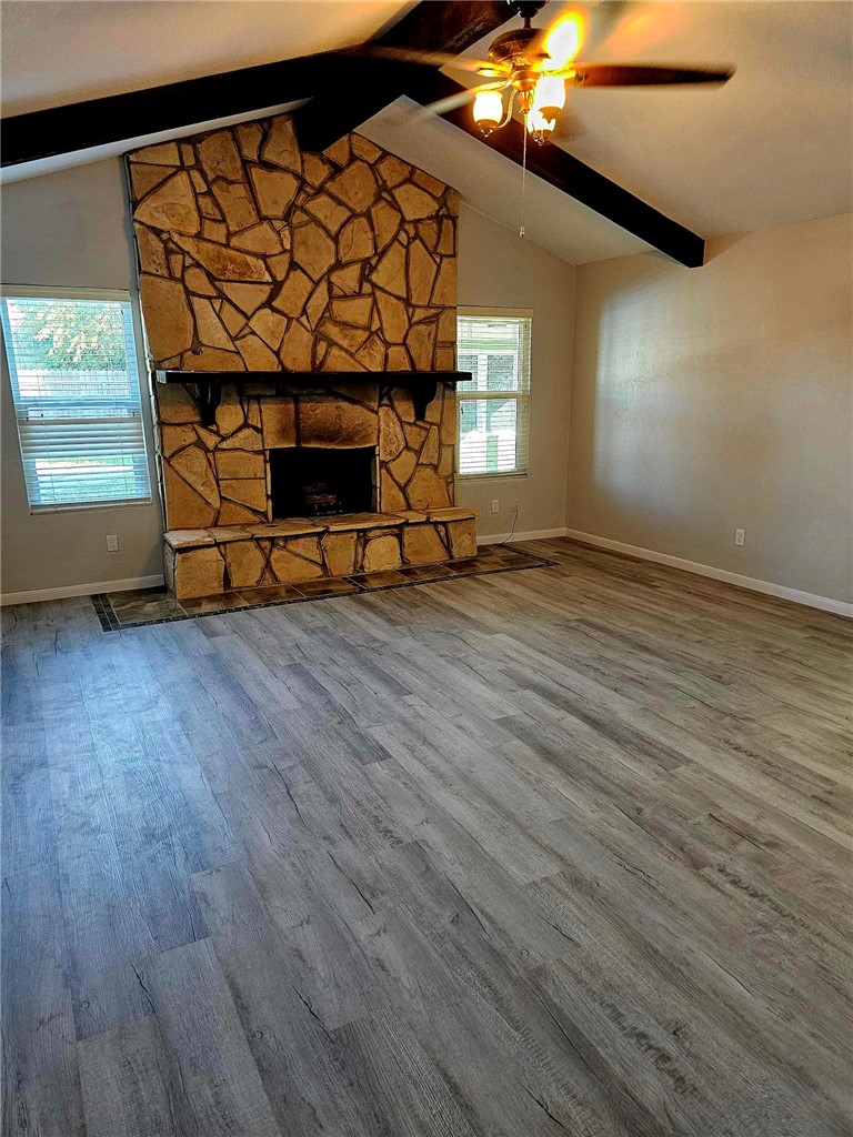2313 Retta Drive Corpus Christi, TX 78418 - Photo 9 of 18 a view of a room with wooden floor staircase and a fireplace