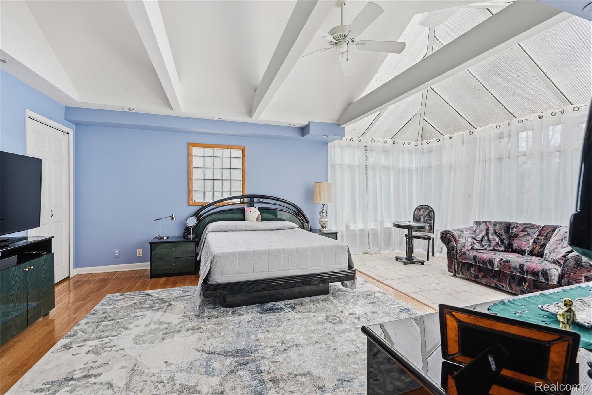 2210 Lancaster Road Bloomfield Hills, MI 48302 - Photo 16 of 35 Bedroom with vaulted ceiling, a ceiling fan, and wood finished floors