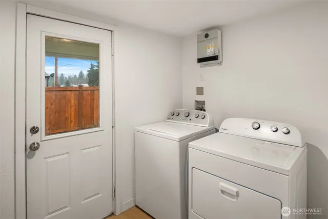 a utility room with dryer and washer