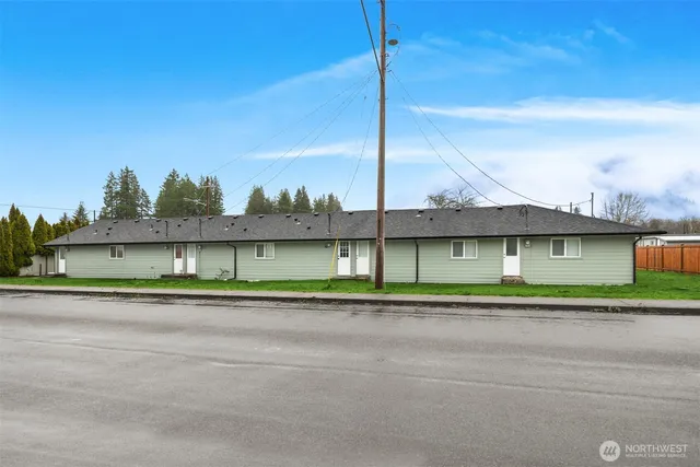 a small white house with a city view