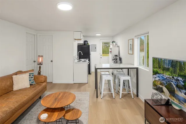 a living room with furniture and a table