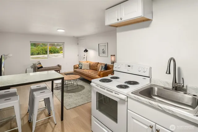 a kitchen with a stove and a sink