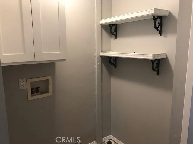 a close view of a sink and dryer