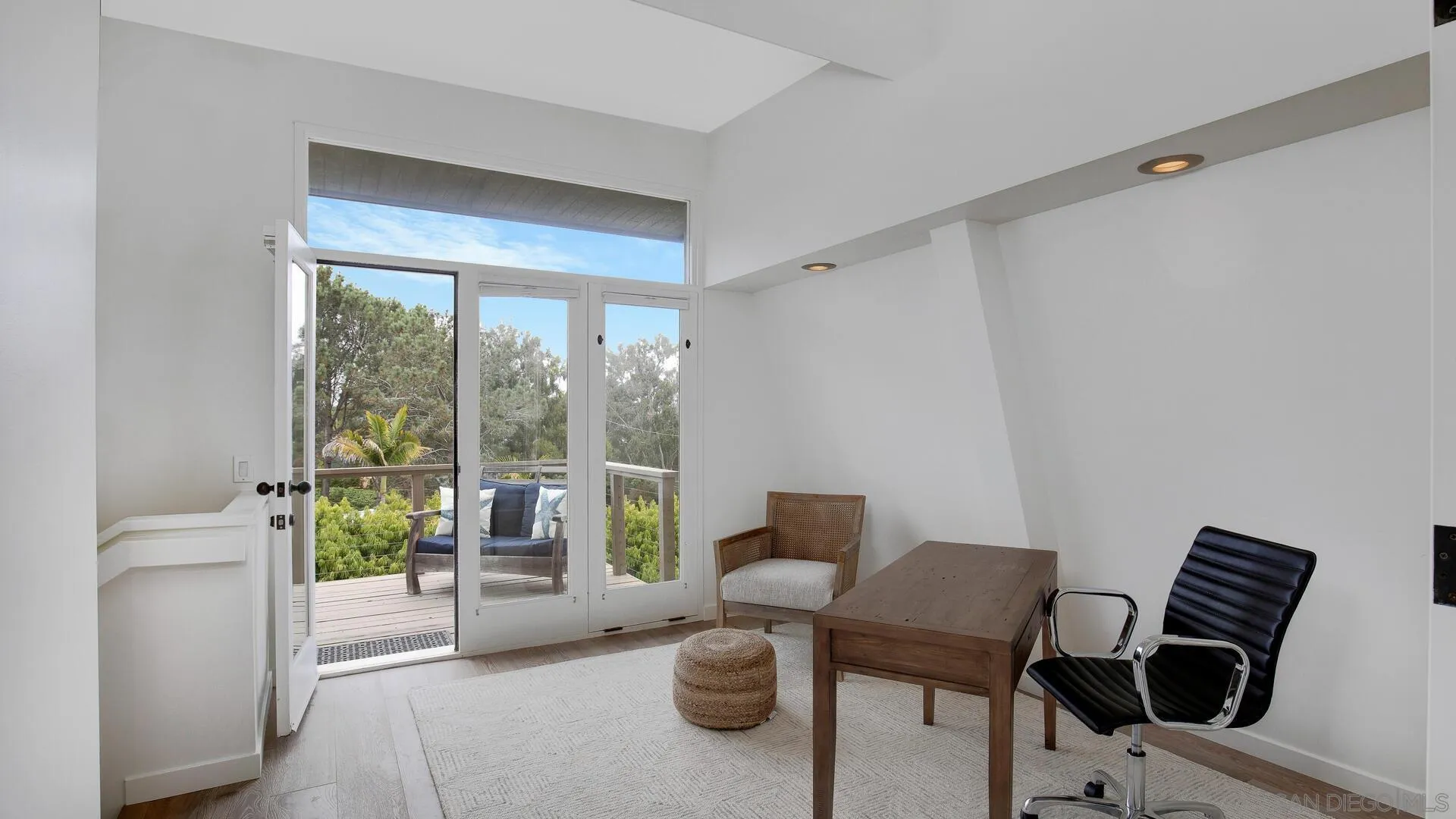 549 Rimini Road Del Mar, CA 92014 - Photo 12 of 32 a living room with furniture and a window