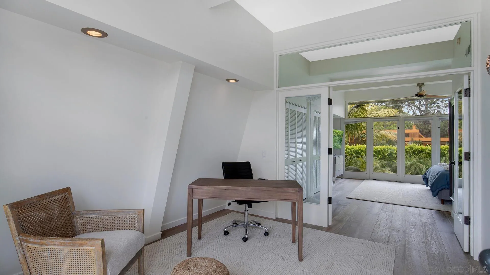 549 Rimini Road Del Mar, CA 92014 - Photo 13 of 32 a living room with furniture and a window