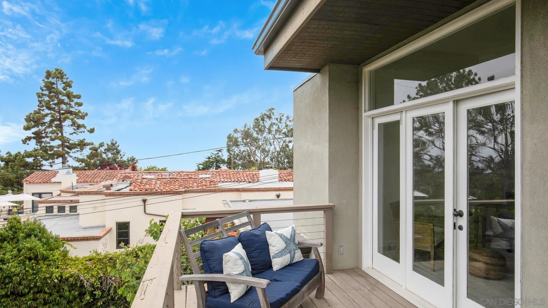 549 Rimini Road Del Mar, CA 92014 - Photo 15 of 32 a view of a patio with table and chairs and potted plants