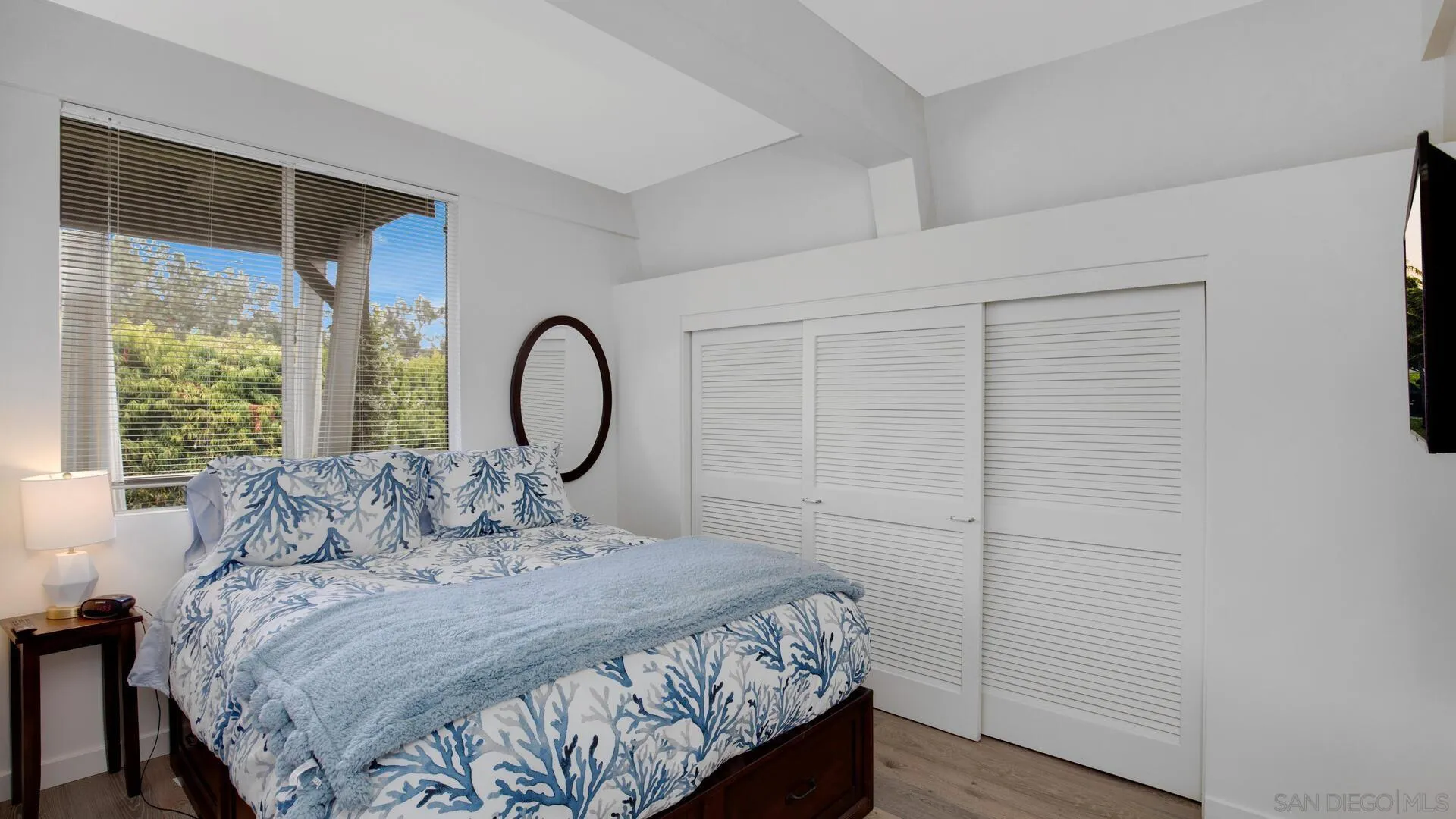 549 Rimini Road Del Mar, CA 92014 - Photo 18 of 32 a bed sitting in a bedroom next to a window