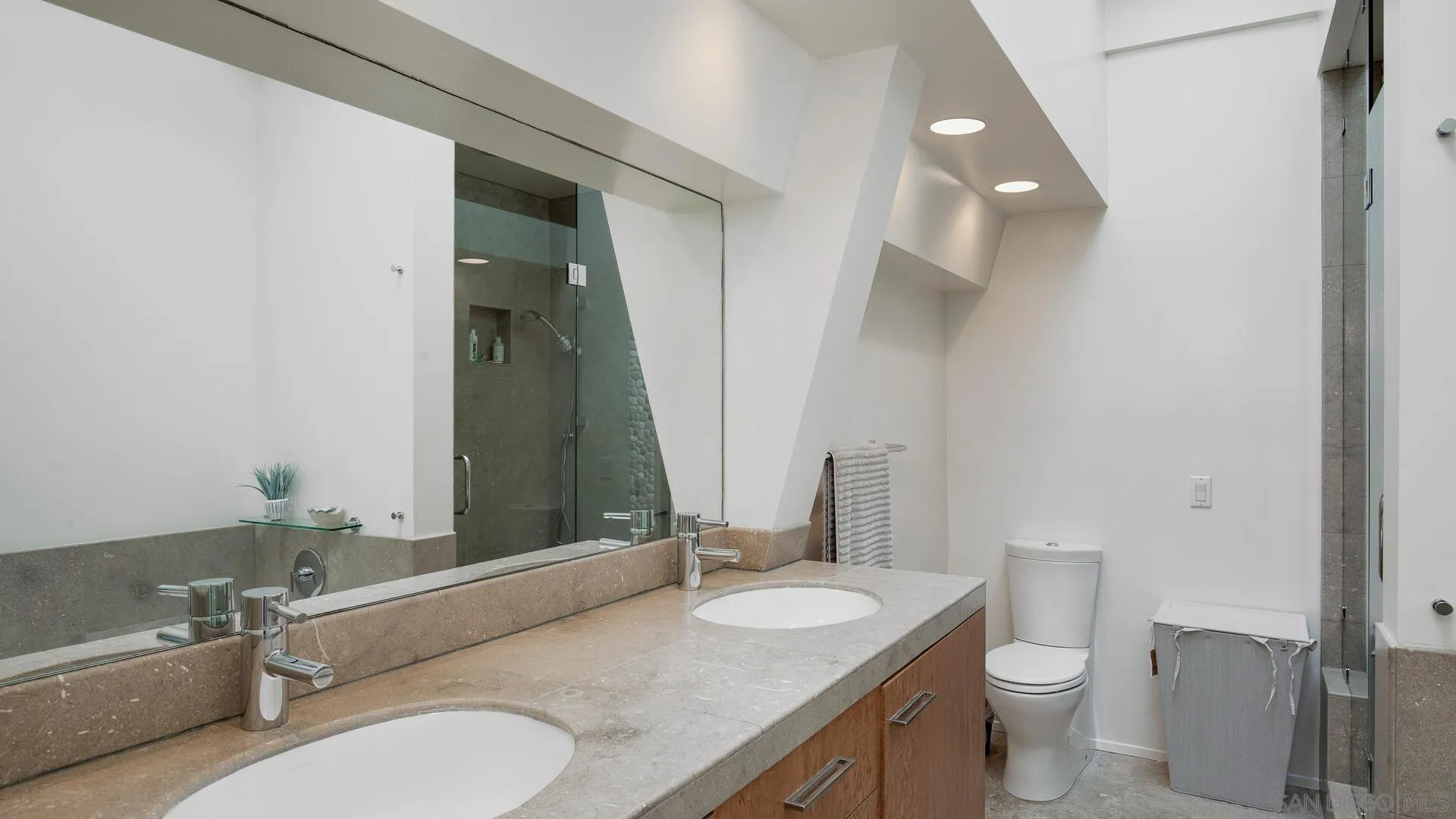 549 Rimini Road Del Mar, CA 92014 - Photo 19 of 32 a bathroom with a granite countertop sink mirror vanity and toilet