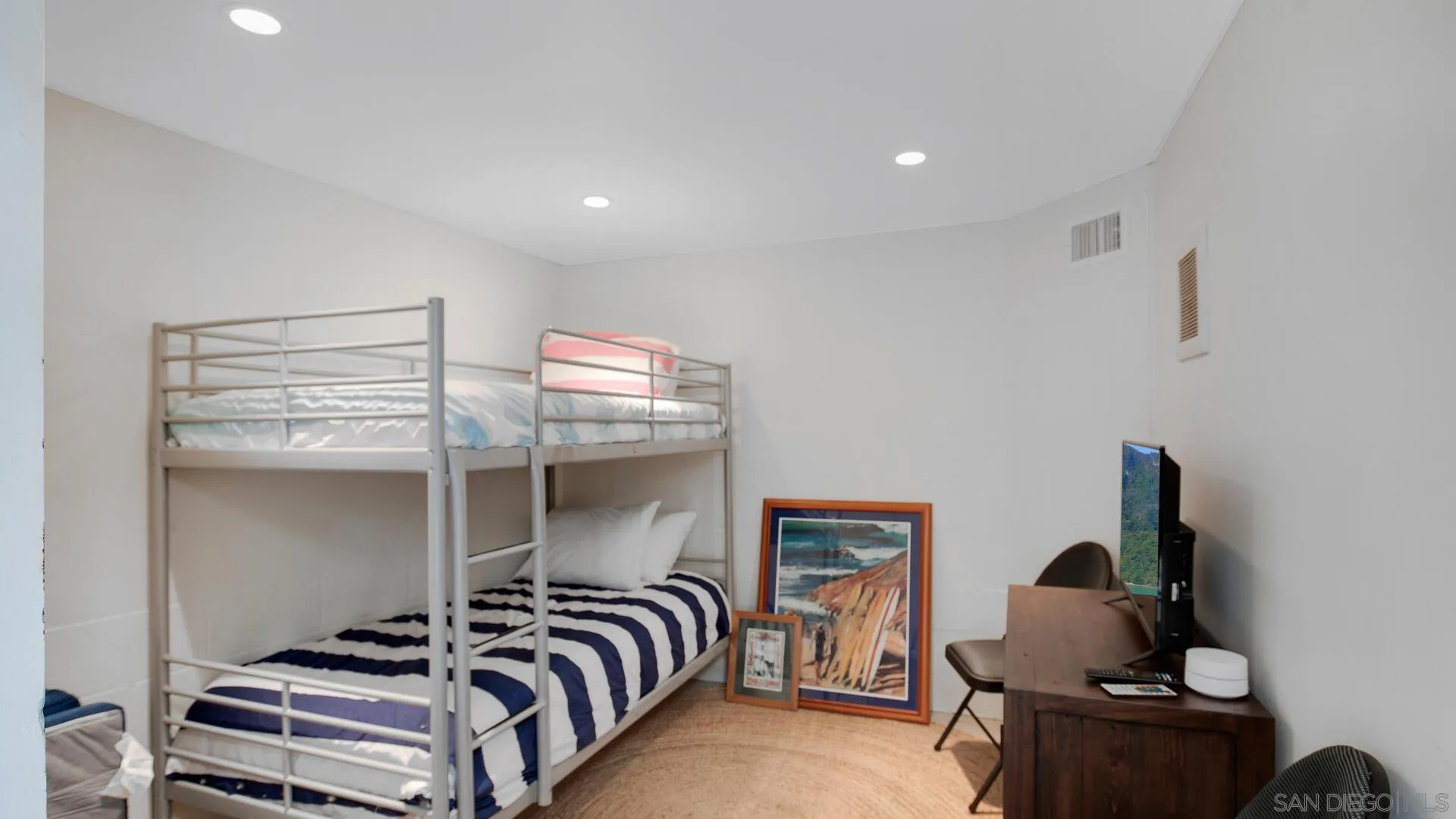 549 Rimini Road Del Mar, CA 92014 - Photo 26 of 32 a bedroom with furniture and a window