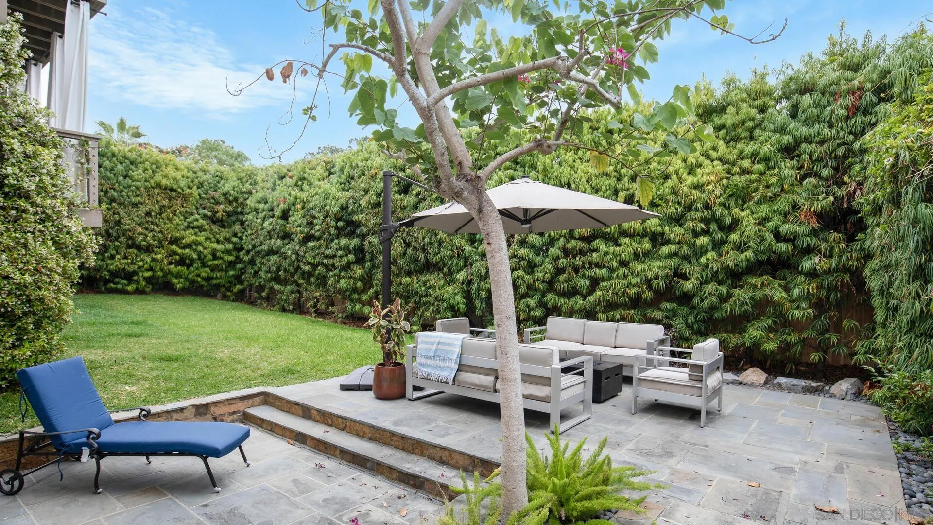 549 Rimini Road Del Mar, CA 92014 - Photo 28 of 32 a view of a patio with chairs and a table