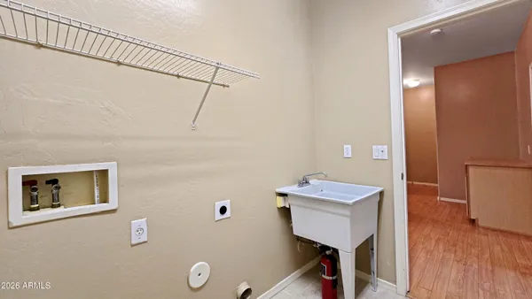 a bathroom with a sink mirror and toilet