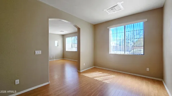a view of livingroom with hardwood floor and hallway
