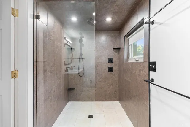 a bathroom with a shower and a tub