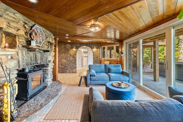 a dining table with chairs and window