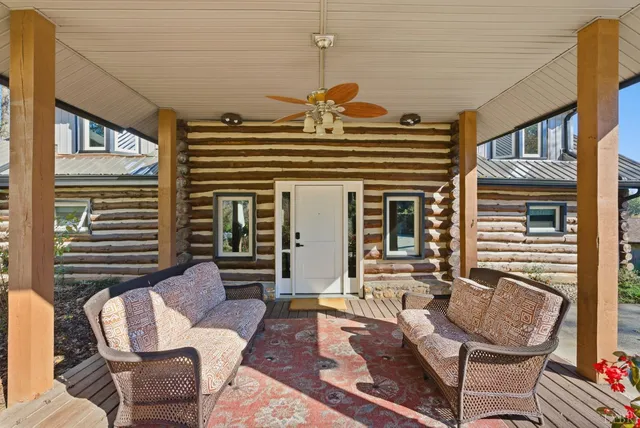 a view of a house with a chairs in patio