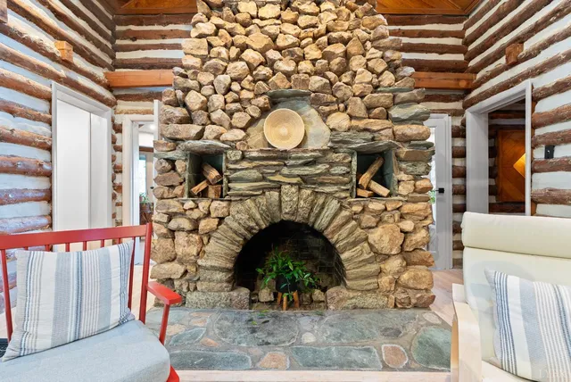 a close view of a fireplace with wooden floor