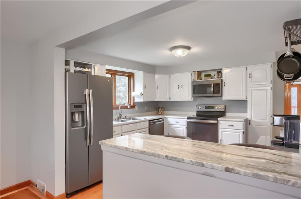220 Kilgallen Road Butler, PA 16002 - Photo 11 of 50 a kitchen with stainless steel appliances granite countertop a refrigerator stove and sink