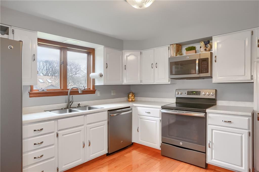 220 Kilgallen Road Butler, PA 16002 - Photo 12 of 50 a kitchen with white cabinets appliances and a window