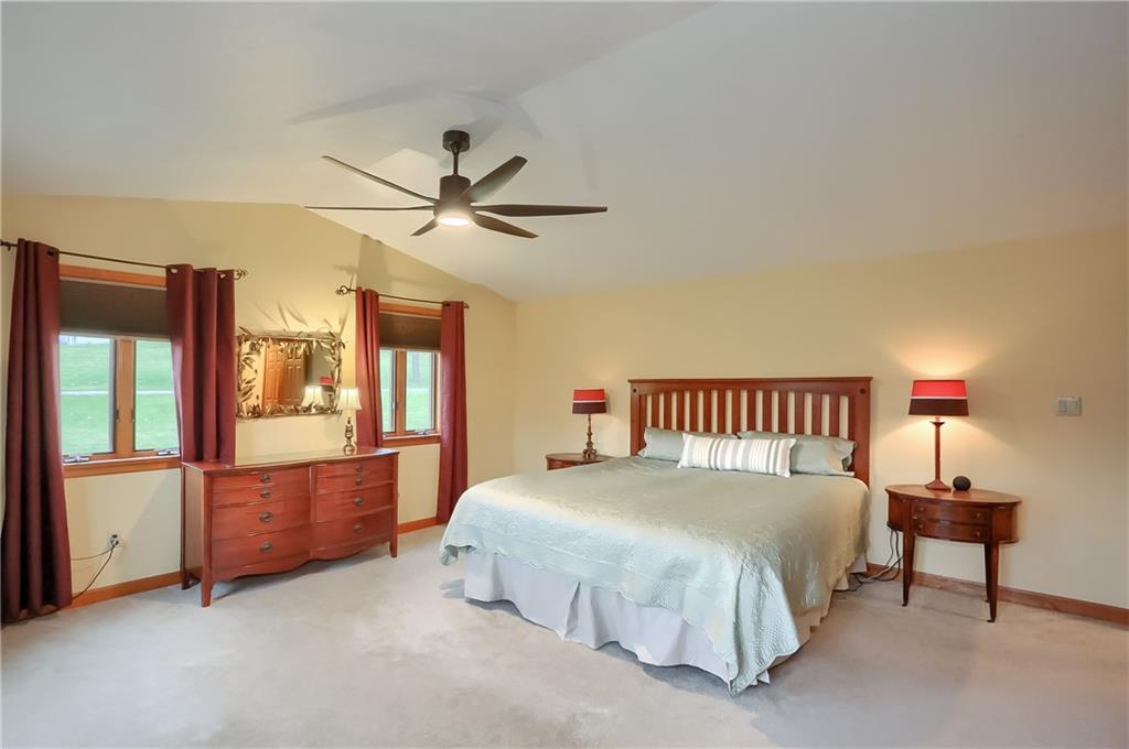 220 Kilgallen Road Butler, PA 16002 - Photo 27 of 50 a bedroom with a large bed and a chandelier fan