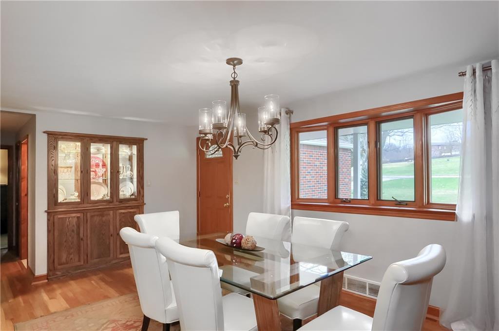 220 Kilgallen Road Butler, PA 16002 - Photo 6 of 50 a dining room with furniture a chandelier and wooden floor
