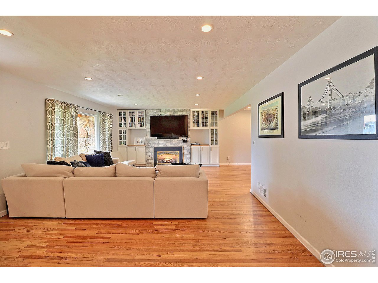 1712 Montview Road Greeley, CO 80631 - Photo 6 of 50 with Lovely Hardwood Floors and Gas Fireplace Surrounded By Beautiful Built-Ins