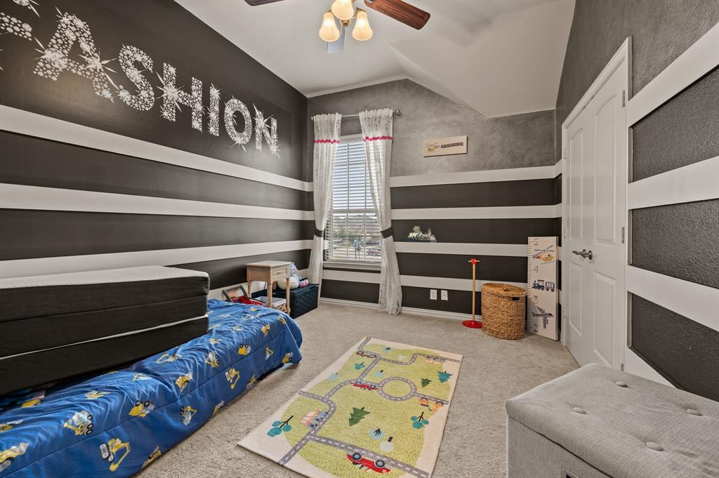616 Whitetail Road Euless, TX 76039 - Photo 26 of 39 Bedroom with light colored carpet, lofted ceiling, and a ceiling fan