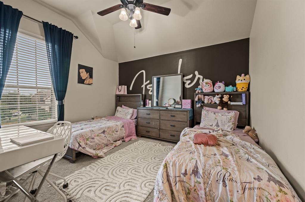 616 Whitetail Road Euless, TX 76039 - Photo 29 of 39 Bedroom with carpet floors, vaulted ceiling, and a ceiling fan