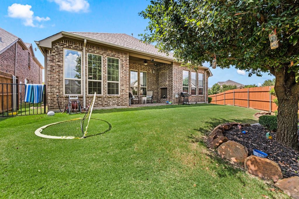 616 Whitetail Road Euless, TX 76039 - Photo 35 of 39 Back of property featuring a fenced backyard, a patio, a ceiling fan, and brick siding