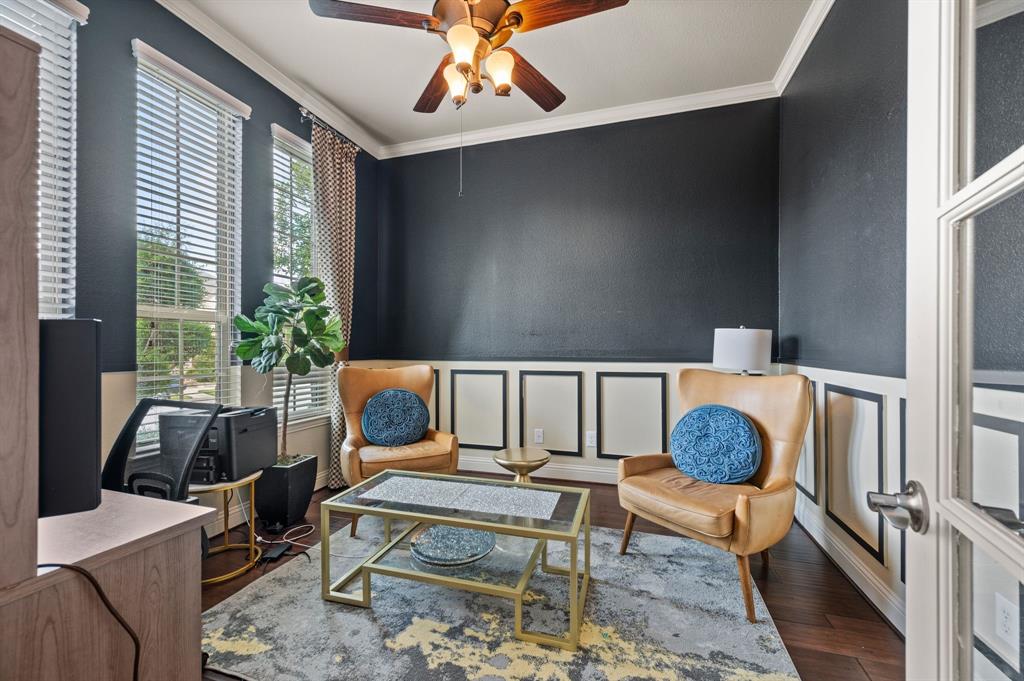 616 Whitetail Road Euless, TX 76039 - Photo 5 of 39 Sitting room featuring ornamental molding, dark wood-style floors, a ceiling fan, a decorative wall, and an office area