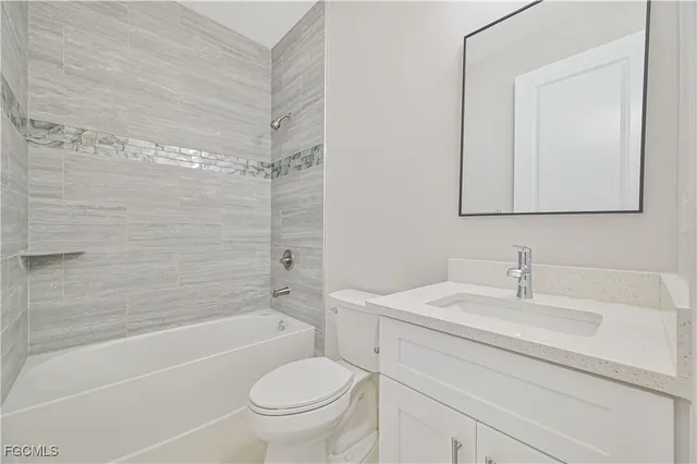 a bathroom with a sink a toilet and a bathtub