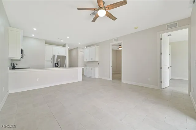 a view of a kitchen with a sink and cabinets