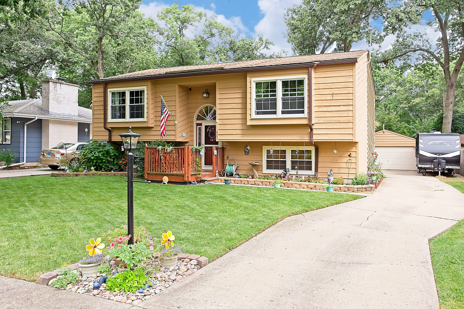 a front view of house with yard and green space