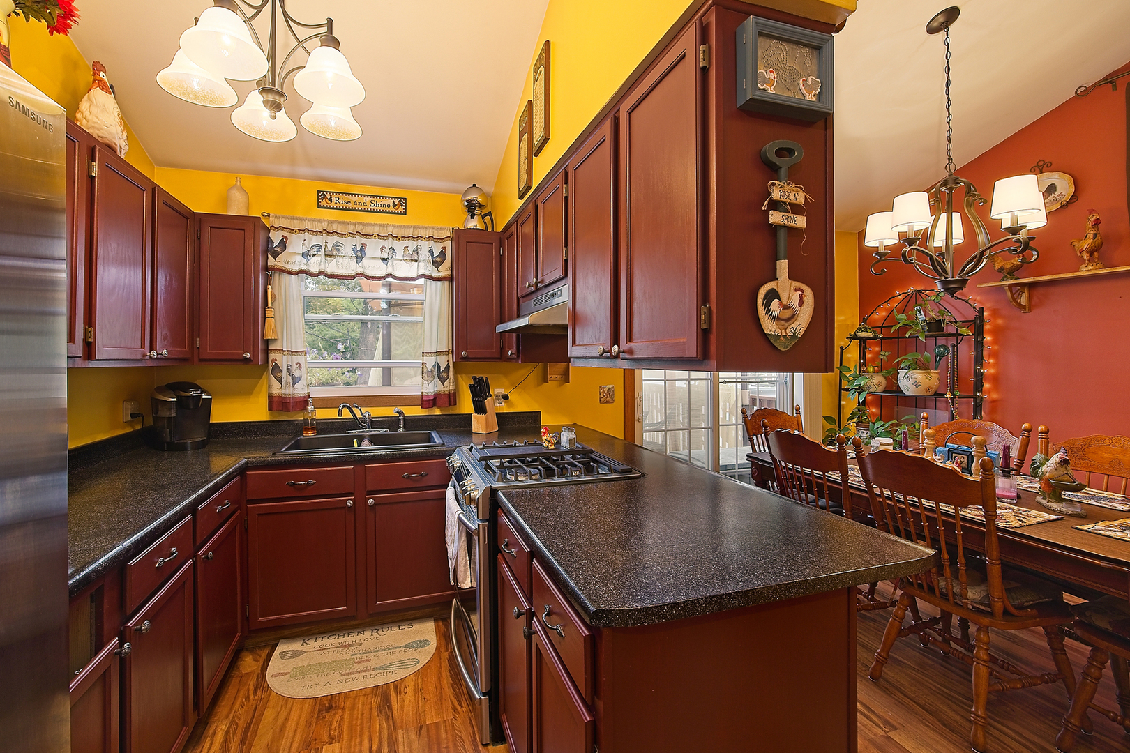 902 Wilson Court Zion, IL 60099 - Photo 14 of 30 a kitchen with stainless steel appliances granite countertop a sink a counter space and cabinets