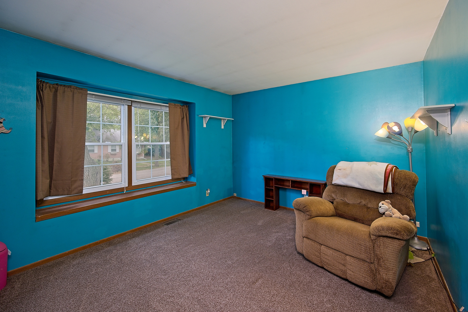 902 Wilson Court Zion, IL 60099 - Photo 20 of 30 a room with furniture and a window