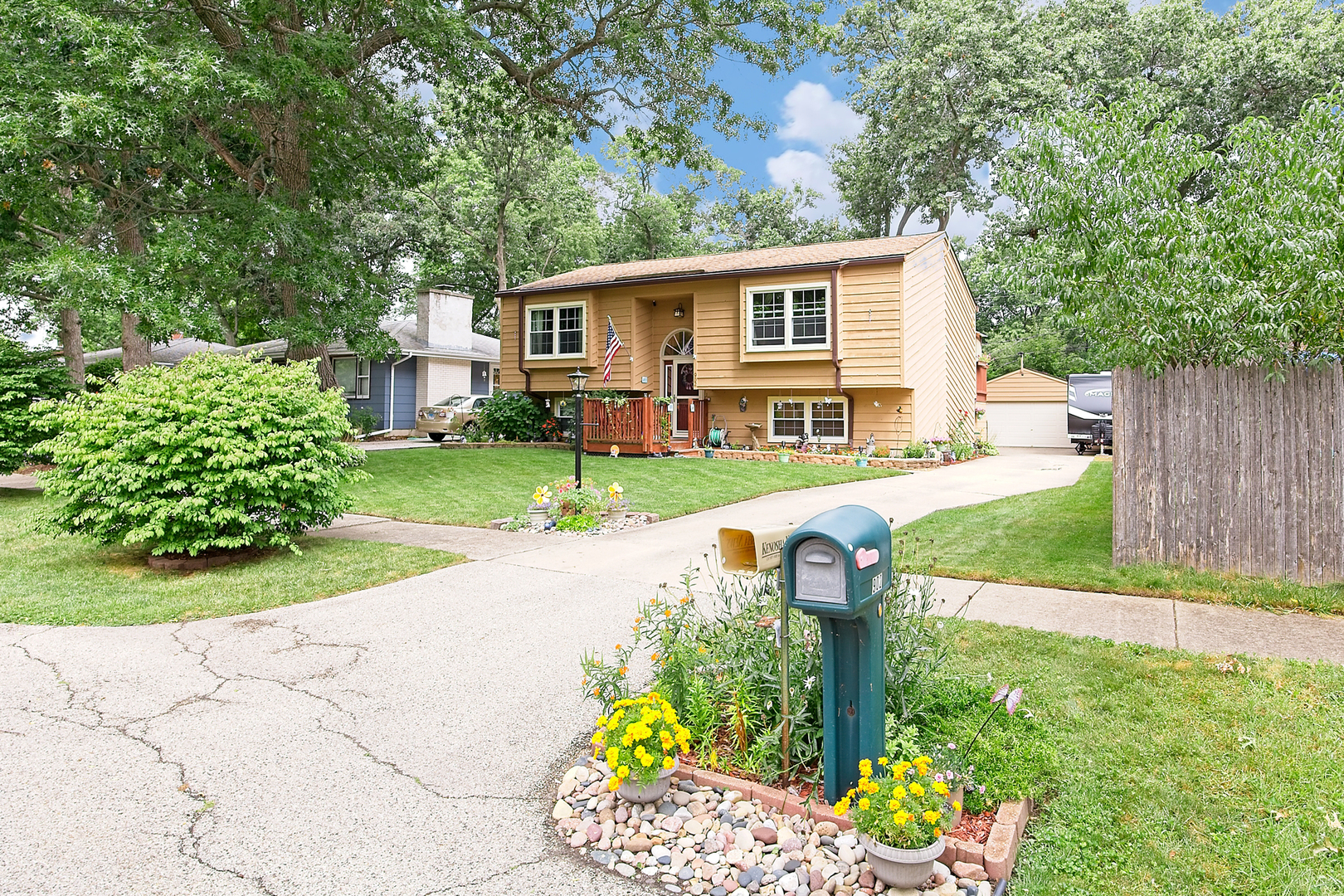 902 Wilson Court Zion, IL 60099 - Photo 2 of 30 a front view of a house with a yard fire pit and outdoor seating