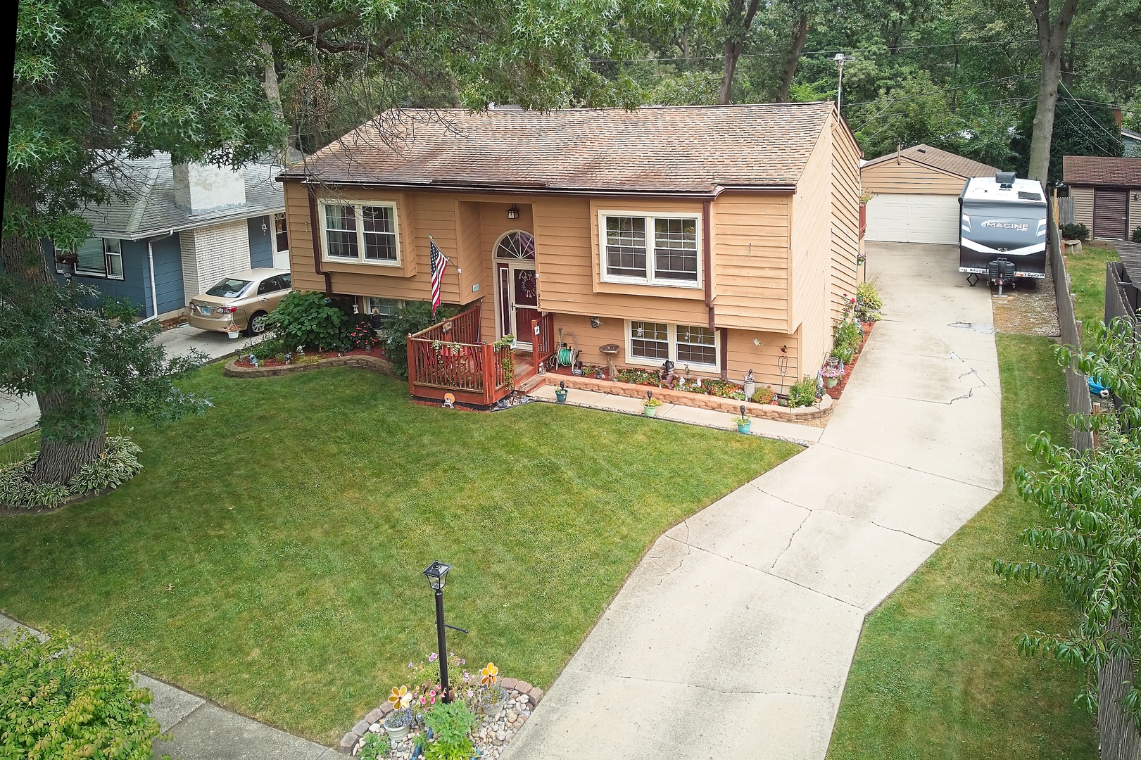 902 Wilson Court Zion, IL 60099 - Photo 30 of 30 a view of a house with a backyard porch and sitting area