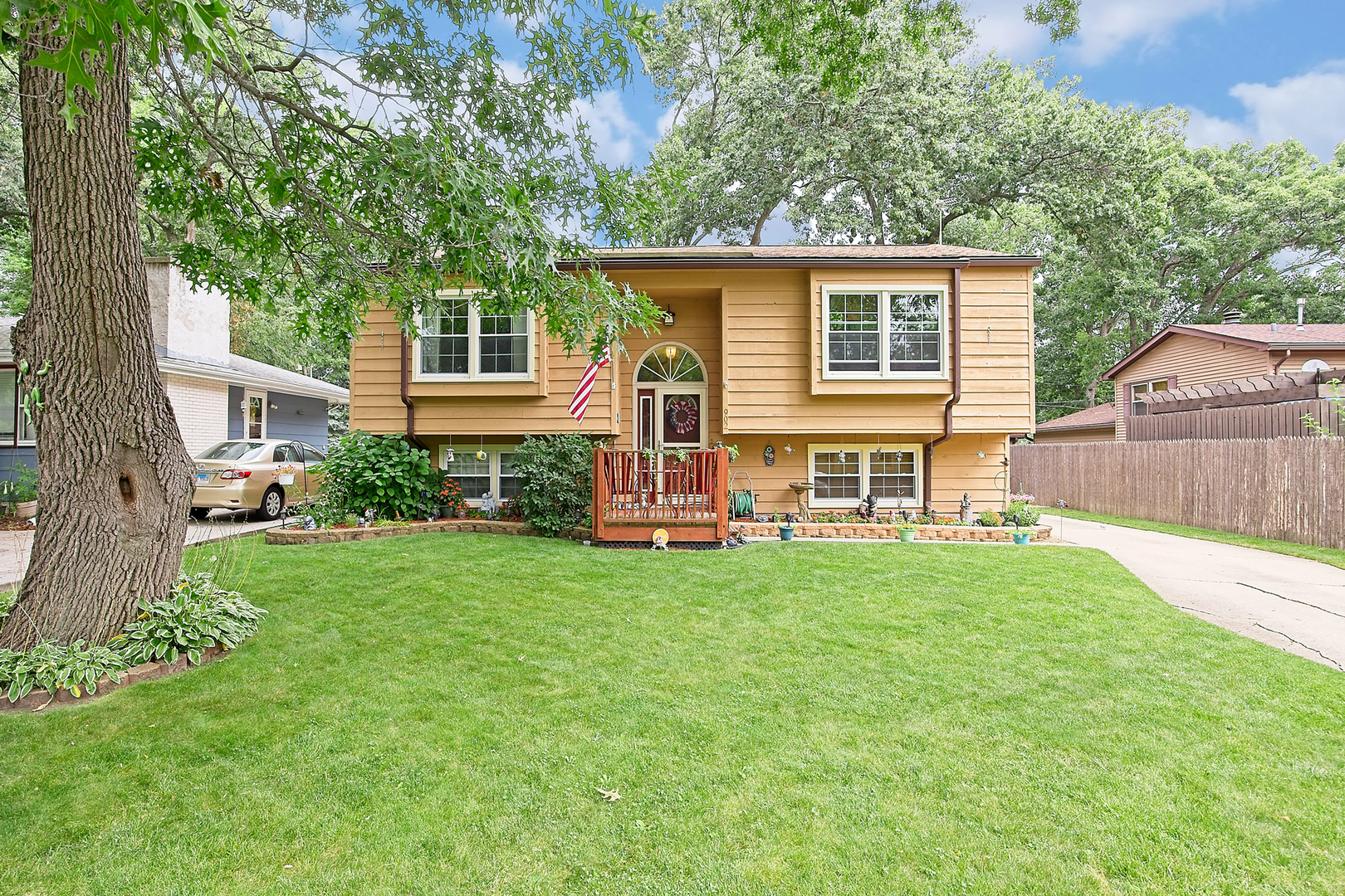 902 Wilson Court Zion, IL 60099 - Photo 3 of 30 a backyard of a house with table and chairs