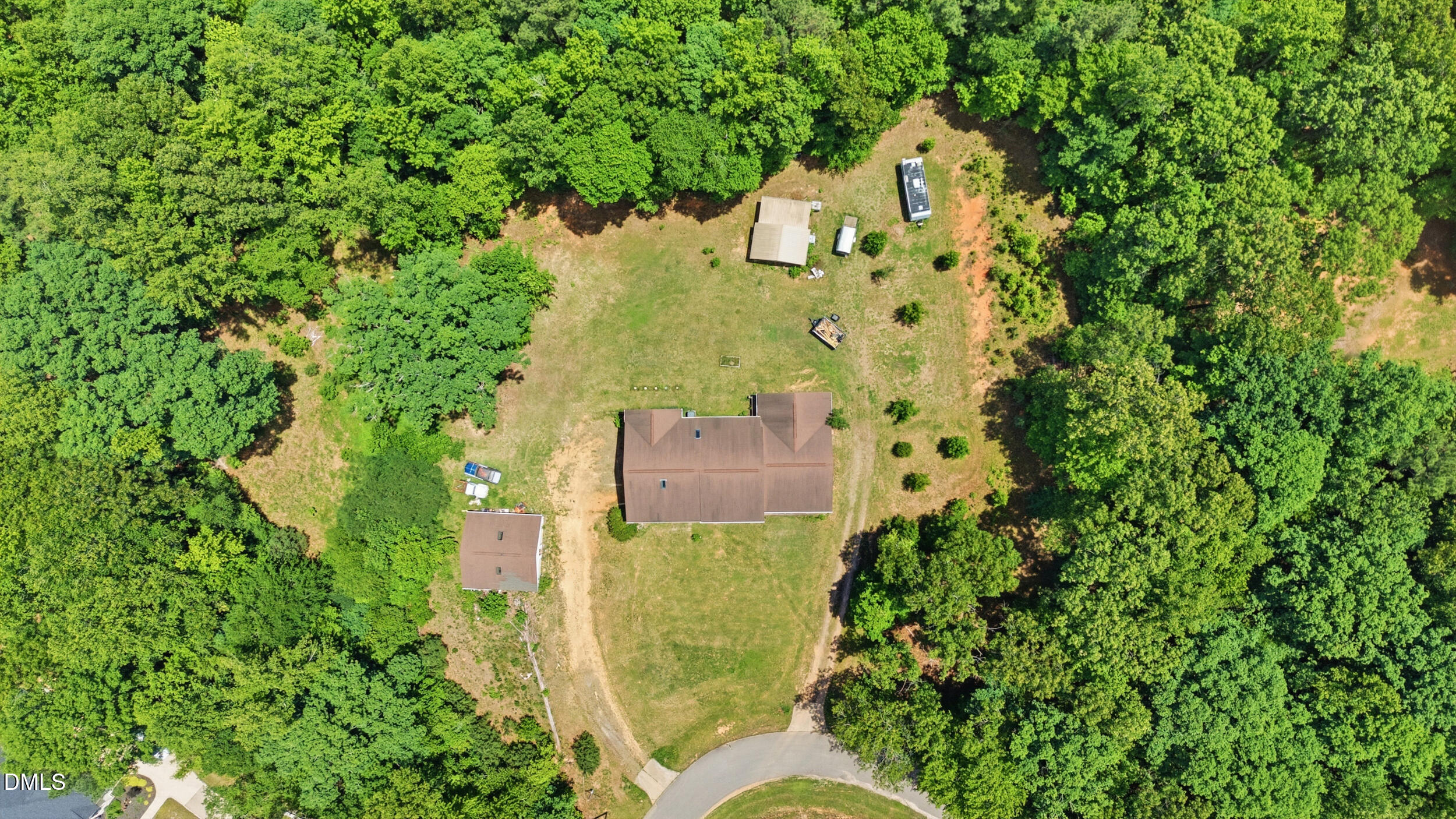 129 Shaman Drive Spring Hope, NC 27882 - Photo 33 of 43 an aerial view of a house with a yard swimming pool and garden