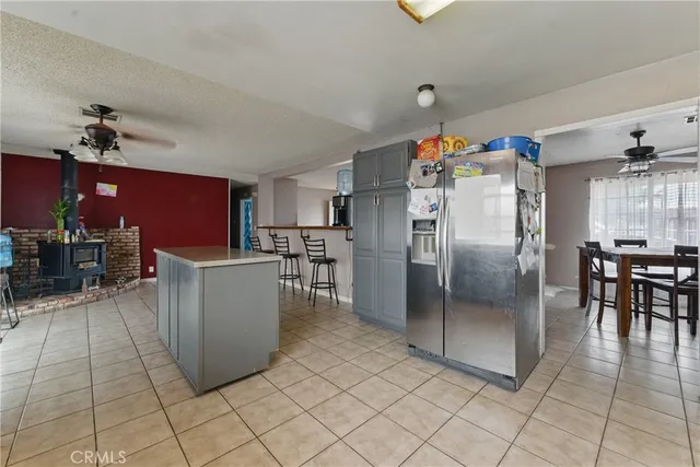 a kitchen with refrigerator and cabinets