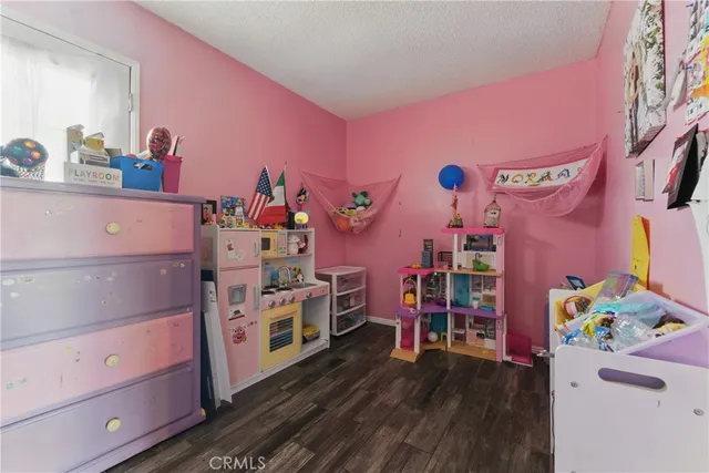 a utility room with lots of wooden furniture and clutter