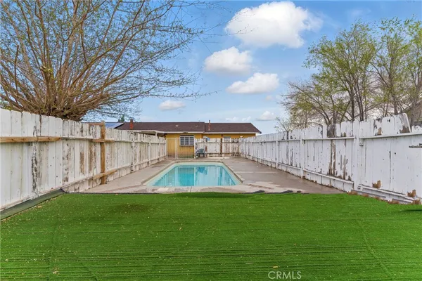 a view of a backyard with a trampoline