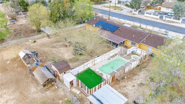 swimming pool view with a sitting space