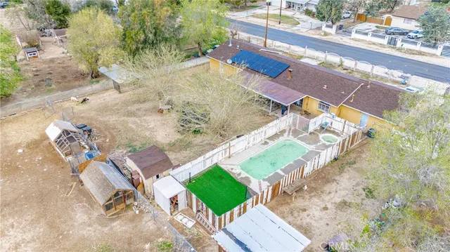 swimming pool view with a sitting space